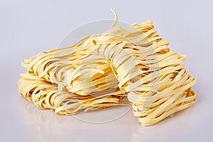 Dry thick rolled noodles square shape. Capelli d`angelo, Angel`s hair - pasta.