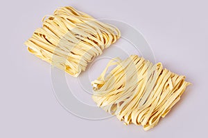 Dry thick rolled noodles square shape. Capelli d`angelo, Angel`s hair - pasta. photo