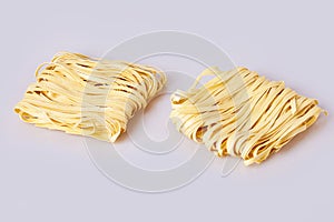 Dry thick rolled noodles square shape. Capelli d`angelo, Angel`s hair - pasta. photo