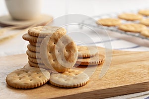 Dry thin circle crispy crackers on cutting board