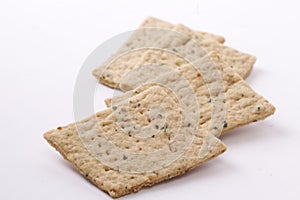 Dry thin lemon leaves crackers. Tasty crispy crackers isolated on white