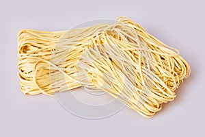 Dry thin rolled noodles square shape. Capelli d`angelo, Angel`s hair - pasta. photo