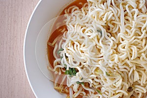 Dry tomyum noodle on wooden table