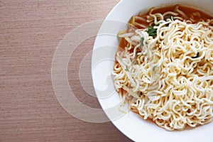 Dry tomyum noodle on wooden table