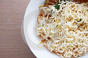 Dry tomyum noodle on wooden table