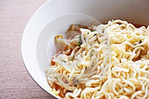 Dry tomyum noodle on wooden table