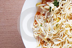 Dry tomyum noodle on wooden table