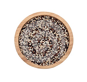 Dry tricolor quinoa in wooden bowl on white background