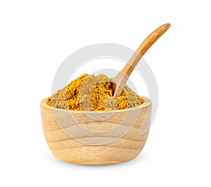 Dry turmeric powder or curcuma longa linn in spoon and wooden bowl isolated on white background