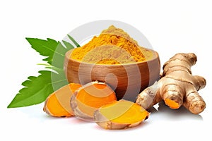 Dry turmeric powder in wooden bowl with fresh turmeric root sliced isolated and green leaves on white background.