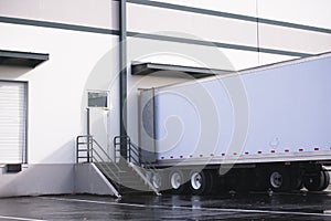 Dry van semi trailer loading and unloading commercial cargo in w