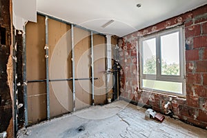 Dry wall construction in empty bathroom during home renovation