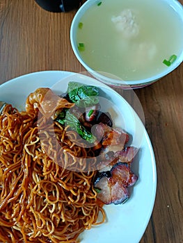 Dry wantan Mee. Chinese breakfast barbeque pork dry noodle. Char siew. photo