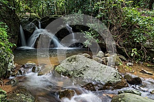 Dry waterfall in deep tropical rain forest in summer