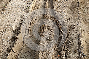 Dry wheel track on dirt soil texture