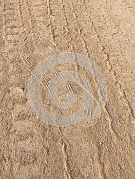 Dry wheel track on dirt soil texture
