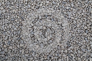 Dry white limestone ballast flat full frame background. Small gray dusty broken macadam stones texture.