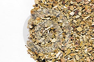 Dry Yerba Mate leaves on white background photo