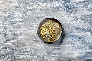 Dry yerba mate leaves on wooden background. Top view.