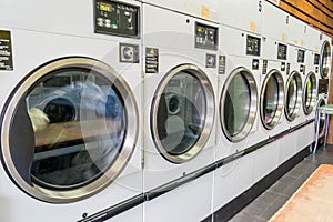 Dryers at laundromat photo