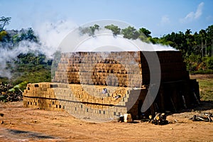 Drying and burning of bricks made of clay with fire wood
