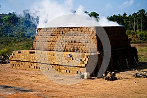 Drying and burning of bricks made of clay with fire wood