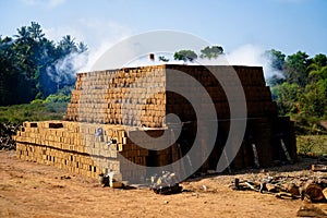 Drying and burning of bricks made of clay with fire wood