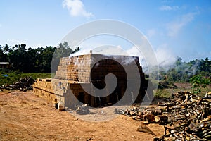 Drying and burning of bricks made of clay with fire wood