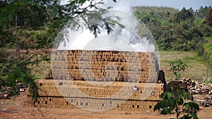 Drying and burning of bricks made of clay with fire wood