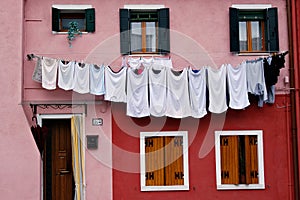Drying clothes on a house in Burano, Italy