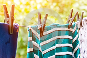 Drying clothes outdoors. Washed clothes on a rope.