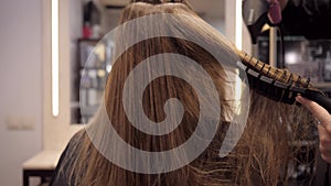 Drying with a hair dryer in the hairdresser's salon.