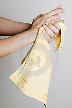 Drying hands with a towel photo