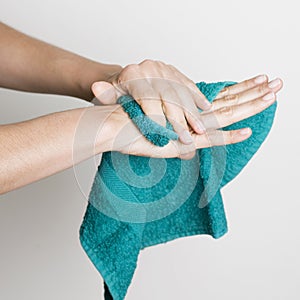 Drying hands with a towel