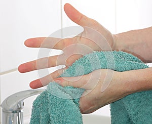 Drying hands using a towel