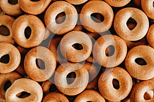 Drying or mini round bagels oas a background image. Top view. Copy, empty space for text