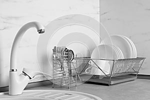 Drying rack with clean dishes and cutlery holder