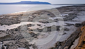 Drying salt lake in the Crimea, self-sedimentary salt on the silty shore of the lake