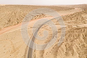 Dryness land with erosion terrain with highway crossing