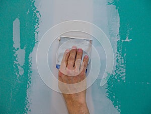 Drywall hydrophobic plasterboard trowel plastering seam photo