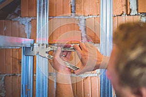 Drywall plaster stud crimpers