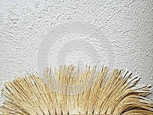 Drywall texture on ceiling. Slap stick and blade tool on white background.