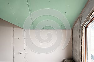 Drywall wall home interior decoration at construction site.