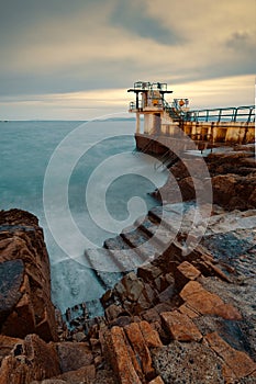 Evening seascape scenery of Blacrock diving tower at Salthill beach in Galway city, Ireland photo
