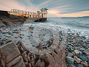 Evening seascape scenery of Blacrock diving tower at Salthill beach in Galway city, Ireland photo