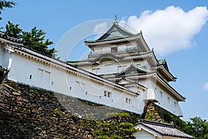 Wakayama Castle Tenshukaku, one of Japan's top 100 castles, against a clear blue sky. Japan