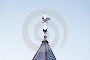 Iconic rooster weathercock on the spire of Kazamidori no Yakata. Kobe, Hyogo, Japan.