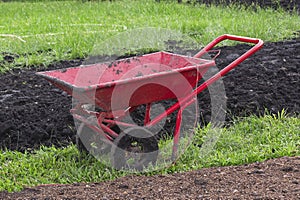 Dual Wheel Barrow, Double Wheel Cement Cart in the garden