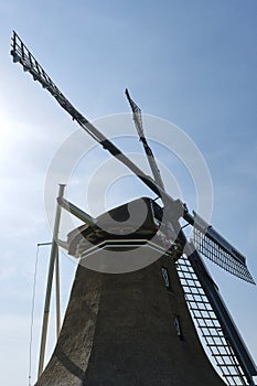 Closeup of the four wings of a traditional dutch windmill in Hantum