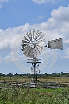 An american wind engine against a blue sky